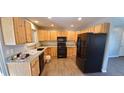 Updated kitchen with stainless steel appliances, granite countertops, and wood cabinets at 2741 W 134Th Cir, Broomfield, CO 80020