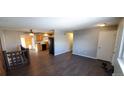 Open-concept living space with modern flooring and an eat-in kitchen at 2741 W 134Th Cir, Broomfield, CO 80020