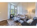 Bright living room with large window, neutral color palette, and stylish decor at 5645 S Himalaya Way, Centennial, CO 80015