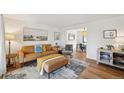 Open-concept living room with stylish decor and seamless flow to dining area at 841 Beech St, Golden, CO 80401