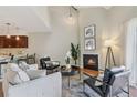 Vaulted living area with fireplace is open to the breakfast bar at 10550 W Jewell Ave # 301, Lakewood, CO 80232