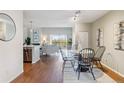 Bright living area with hardwood floors, stainless steel appliances and a lake view at 10550 W Jewell Ave # 301, Lakewood, CO 80232