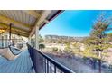 Relaxing deck view featuring mountains and clear skies, enhanced by a comfortable hammock at 6301 Perry Park Blvd # 22, Larkspur, CO 80118