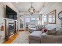 Relaxing living room with fireplace and large windows at 7865 Vallagio Ln # 308, Englewood, CO 80112