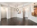 Spacious living room with an ornamental divider to the kitchen and lots of natural light at 7865 Vallagio Ln # 308, Englewood, CO 80112