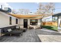 Relaxing outdoor space with stylish lounge seating and cozy fire pit at 1248 Ursula St, Aurora, CO 80011
