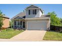 Well-maintained two-story home showcasing a classic design and attached two-car garage at 21351 E Williamette Pl, Centennial, CO 80015
