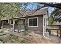 A quaint house showing the side and front, showcasing a small deck and well-maintained gravel landscaping at 6780 W 84Th Cir # 66, Arvada, CO 80003