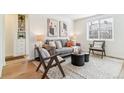 Cozy living room with stylish furniture, modern art, and an area rug, creating a warm and inviting atmosphere at 2550 Kendall St, Edgewater, CO 80214