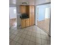 View of kitchen, microwave, and connecting room at 926 Perry St, Denver, CO 80204