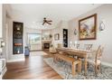 Bright and airy living room featuring hardwood floors, fireplace, and stylish decor at 737 Novick Ct, Castle Rock, CO 80109