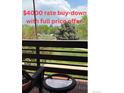 Balcony with outdoor seating and a view of trees and open space at 539 Wright St # 203, Lakewood, CO 80228