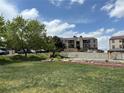 Well-maintained lawn and greenery surrounding the property, providing a serene outdoor space at 539 Wright St # 203, Lakewood, CO 80228