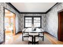 Elegant dining room with statement wallpaper and modern table at 626 Fillmore St, Denver, CO 80206