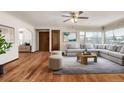 Spacious living room with hardwood floors and a sectional sofa at 3780 Benton St, Wheat Ridge, CO 80212