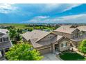 A scenic aerial view captures the roof and landscape, showcasing the home's serene surroundings at 14116 Double Dutch Cir, Parker, CO 80134