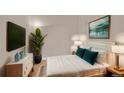 Bright bedroom with a queen-size bed and TV at 2200 S University Blvd # 511, Denver, CO 80210