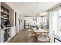 Spacious kitchen featuring white cabinets, stainless steel appliances, and an island at 10270 E 62Nd Pl, Denver, CO 80238