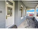 Inviting front porch with seating, perfect for relaxing and enjoying the neighborhood ambiance at 253 N Lincoln St, Denver, CO 80203