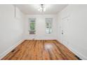 Light filled living room with wood floors, complemented by fresh paint and natural light at 253 N Lincoln St, Denver, CO 80203