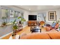 Bright living room with large windows, hardwood floors, comfortable seating, and stylish decor, a perfect space at 755 S Milwaukee St, Denver, CO 80209