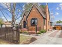 Stunning brick home with updated landscaping and a cozy front porch area at 2910 Clermont St, Denver, CO 80207