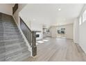 Bright and spacious living room with hardwood floors and a fireplace at 9204 Truckee Ct, Commerce City, CO 80022