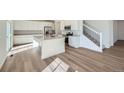 Spacious kitchen island with modern appliances and sleek white cabinetry at 5546 Inland Ave, Firestone, CO 80504