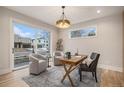 Bright home office featuring hardwood floors and sliding glass doors at 760 Jersey St, Denver, CO 80220