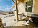 A cozy front porch offers a serene spot to enjoy neighborhood views and morning coffee, perfect for relaxation at 9032 Middle Fork St, Littleton, CO 80125