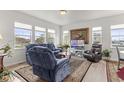 Open concept living area featuring a cozy seating arrangement at 15501 E 112Th Ave # 6F, Commerce City, CO 80022