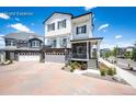 Beautiful two-story house with a paved driveway and a two-car garage, complemented by landscaped greenery at 4443 N Quatar Ct, Aurora, CO 80019