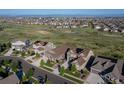 Expansive aerial view of homes with lush green spaces, showcasing community and neighborhood charm at 8761 S Wenatchee Ct, Aurora, CO 80016
