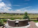 Scenic backyard featuring comfortable seating and a view of the surrounding neighborhood at 8761 S Wenatchee Ct, Aurora, CO 80016
