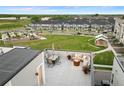 Rooftop patio featuring outdoor seating, dining area, fire pit, and neighborhood views at 12261 Farmview St, Thornton, CO 80241