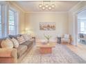Cozy living room featuring hardwood floors, stylish decor, and ample natural light at 541 Fox St, Denver, CO 80204