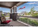 Relaxing front porch view features comfortable seating and a charming neighborhood view at 3022 Merlin Dr, Brighton, CO 80601