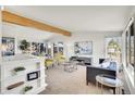 Open-concept living room with comfortable seating, bright decor, and ample natural light at 8005 Emerald Ln, Broomfield, CO 80020
