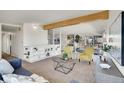 Bright and airy living room with a mid-century modern design and plenty of natural light at 8005 Emerald Ln, Broomfield, CO 80020