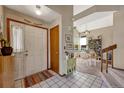 Bright and spacious entryway with view into dining area and staircase at 2134 S Scranton Way, Aurora, CO 80014