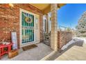 Inviting front entrance with teal door, wreath, and welcome mat at 2134 S Scranton Way, Aurora, CO 80014