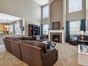 Spacious living room features a fireplace, plush carpet, and lots of natural light at 3309 Springbriar Dr, Castle Rock, CO 80109