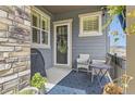 Cozy patio area with seating, a grill, and views of the surrounding landscape at 3477 New Haven Cir, Castle Rock, CO 80109