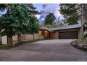 Well-maintained exterior featuring a long driveway and mature trees creating a private setting at 900 Poplar Ave, Boulder, CO 80304
