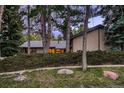 Cozy home exterior with a well-manicured front yard and mature trees, providing a sense of privacy at 900 Poplar Ave, Boulder, CO 80304