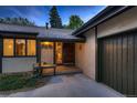 Inviting front entrance showcasing a covered bench and direct access to the attached garage at 900 Poplar Ave, Boulder, CO 80304