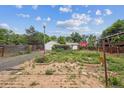 Backyard featuring a detached garage, shed, pergola, swing and potential landscaping at 5935 Blanca Ct, Golden, CO 80403
