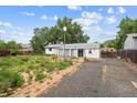 Backyard featuring detached garage, shed, pergola and patio area offering possibilities for outdoor enjoyment at 5935 Blanca Ct, Golden, CO 80403