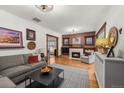 Comfortable living room boasts hardwood floors, fireplace, and stylish decor at 836 Steele St, Denver, CO 80206