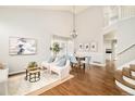 Bright and airy living room with hardwood floors, high ceilings and modern furnishings at 10063 Silver Maple Rd, Highlands Ranch, CO 80129